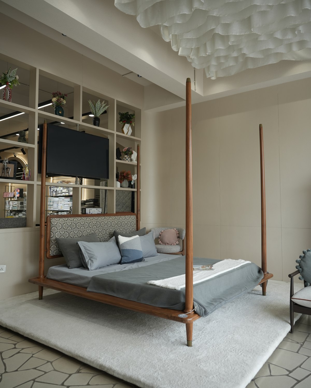 Styled bedroom display with a four-poster bed at Drape Shoppe