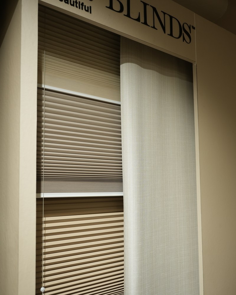 Roman and roller blinds on display at Drape Shoppe