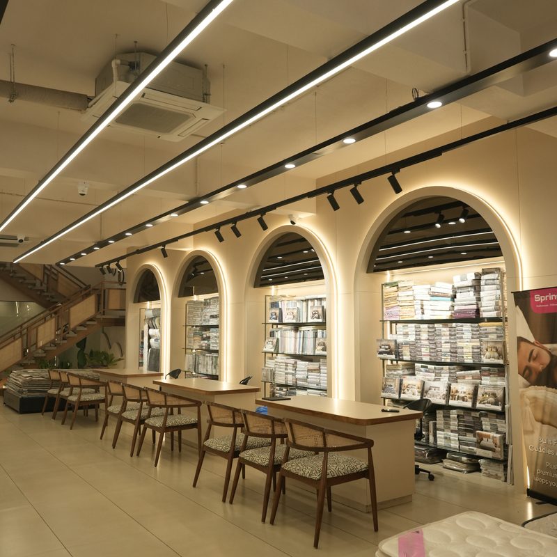 Arched fabric library and consultation desks inside the Drape Shoppe showroom